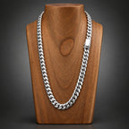 Silver chain necklace on a wooden surface
