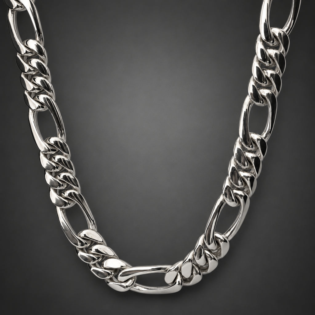Silver chain necklace on a light gray background