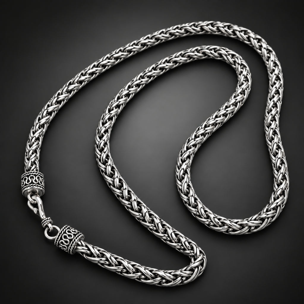 Silver braided necklace on a hand
