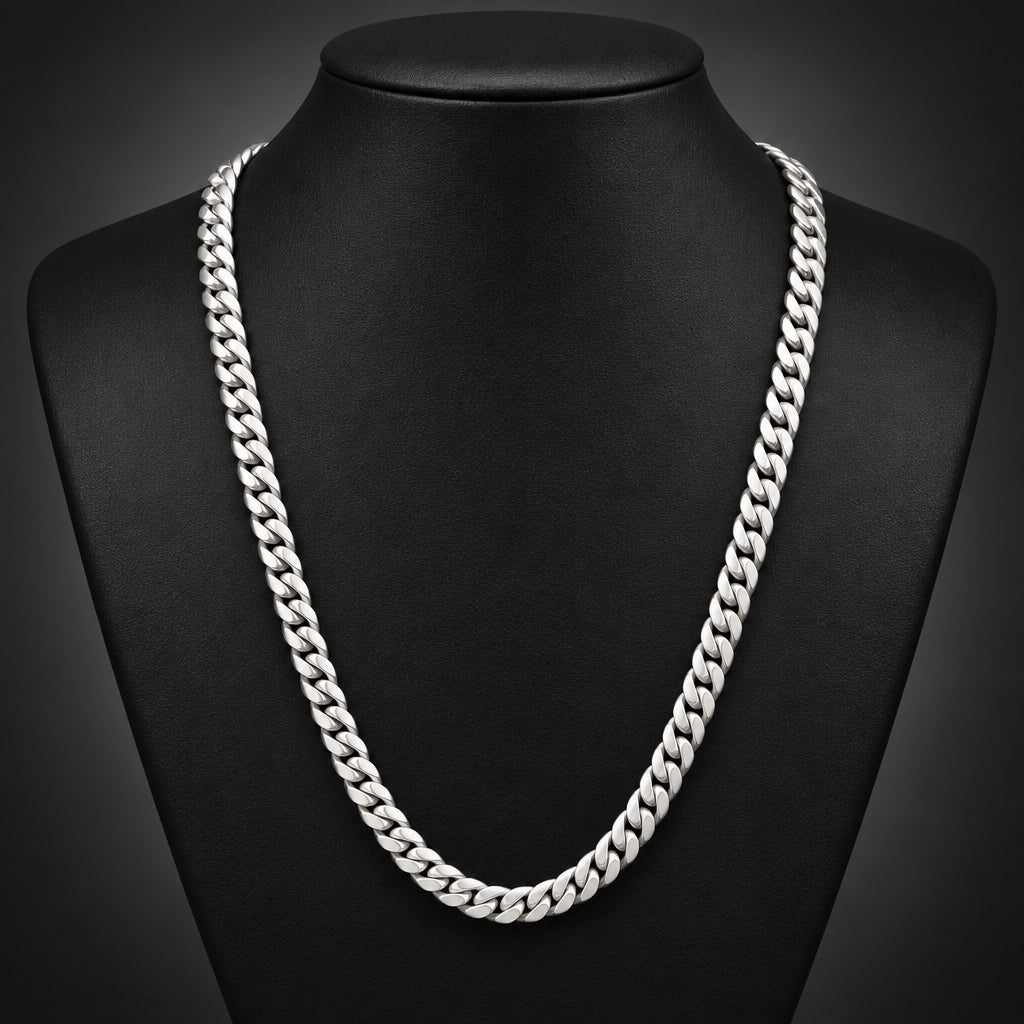 Gold chain on a black textured surface