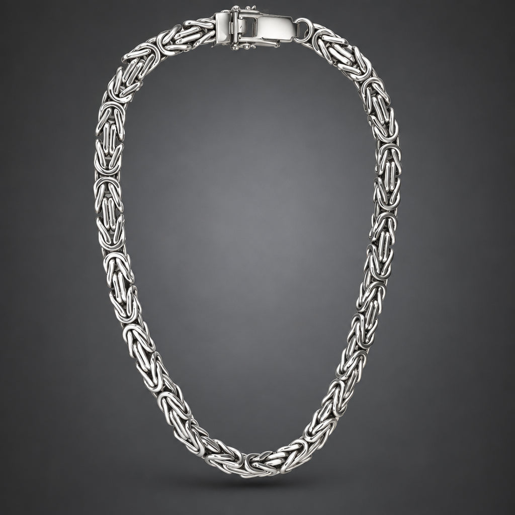 A silver-toned Russian link chain necklace with a polished clasp, displayed in a neat loop against a dark gray gradient background.