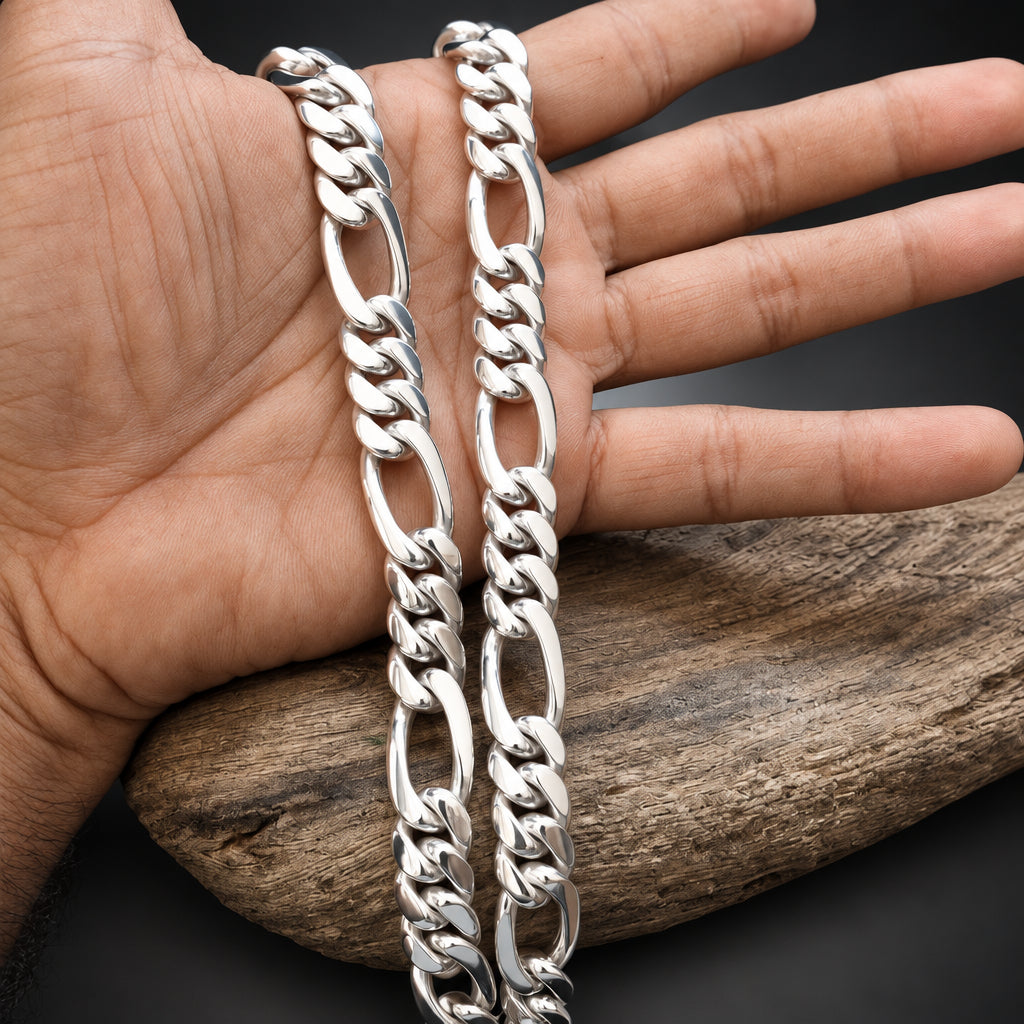 Silver chain bracelet on a hand with a wooden background