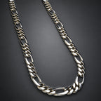 silver chain necklace on a dark background