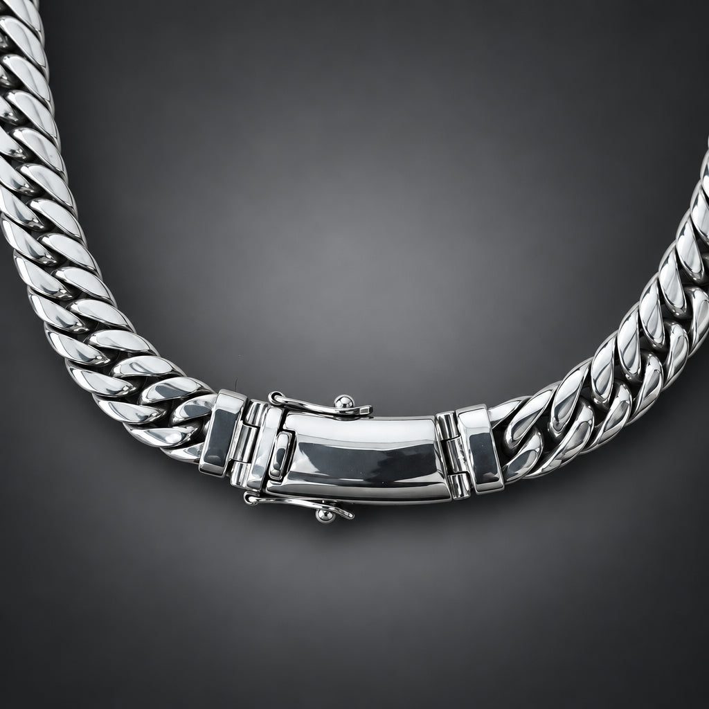 Silver chain bracelet on a dark background.