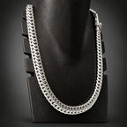 Silver chain necklace on a black background