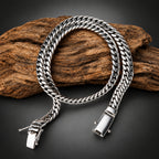 Silver chain bracelet on a wooden surface