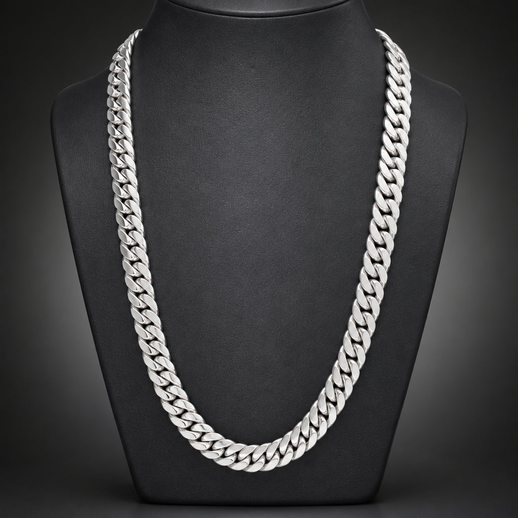 Silver chain necklace on a dark textured background
