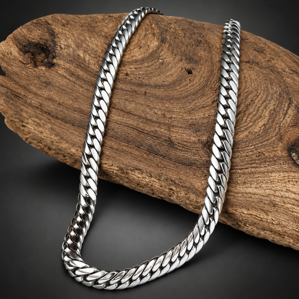 Silver chain necklace on a wooden block