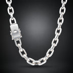 A polished silver chain necklace with a rectangular clasp, shown against a dark gray gradient background.