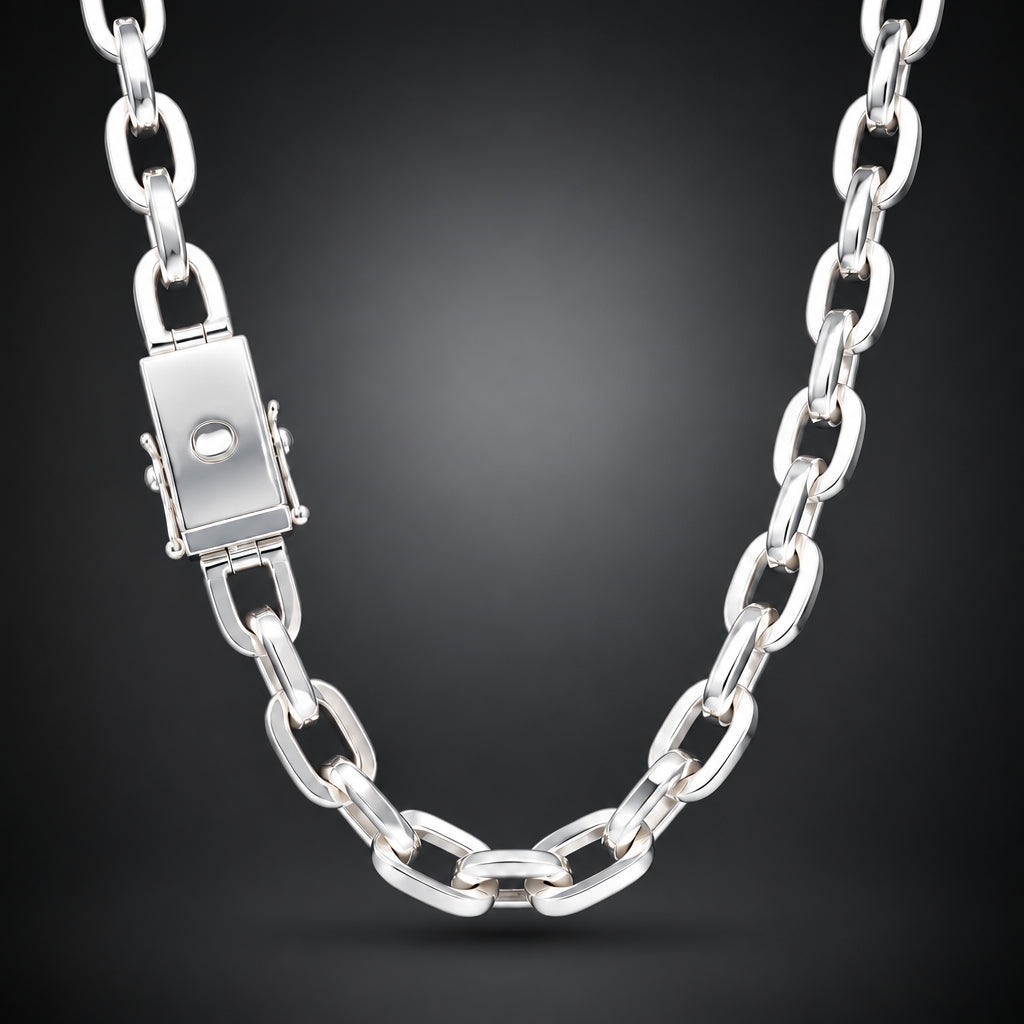 A polished silver chain necklace with a rectangular clasp, shown against a dark gray gradient background.