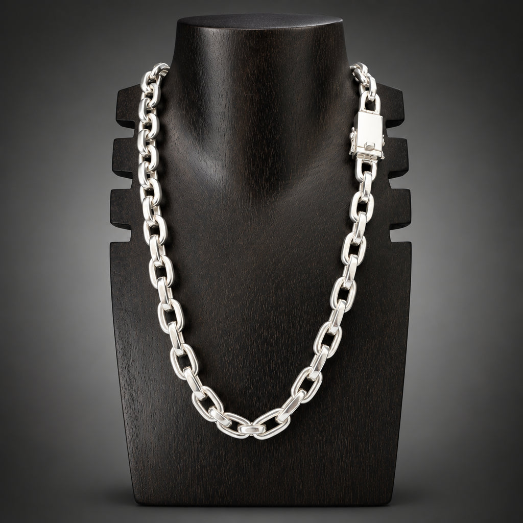 Silver chain necklace on a black mannequin bust