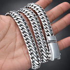 Silver chain bracelet on a hand with a blurred background
