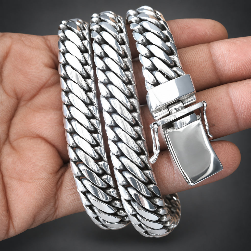 Silver braided bracelet on a hand with a blurred background