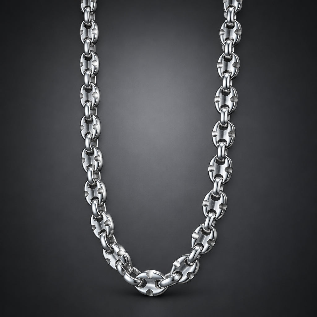 A polished silver-toned metal chain necklace with interlocking oval links, shown draped against a dark gray gradient background.