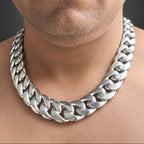 Person wearing a silver chain necklace