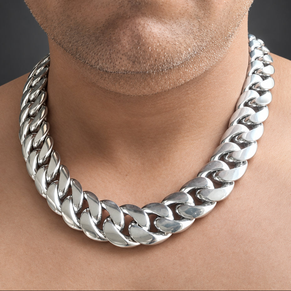 Person wearing a silver chain necklace