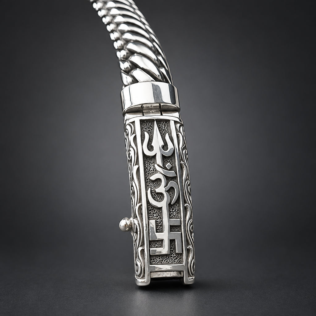 Silver bracelet with intricate designs on a wooden surface