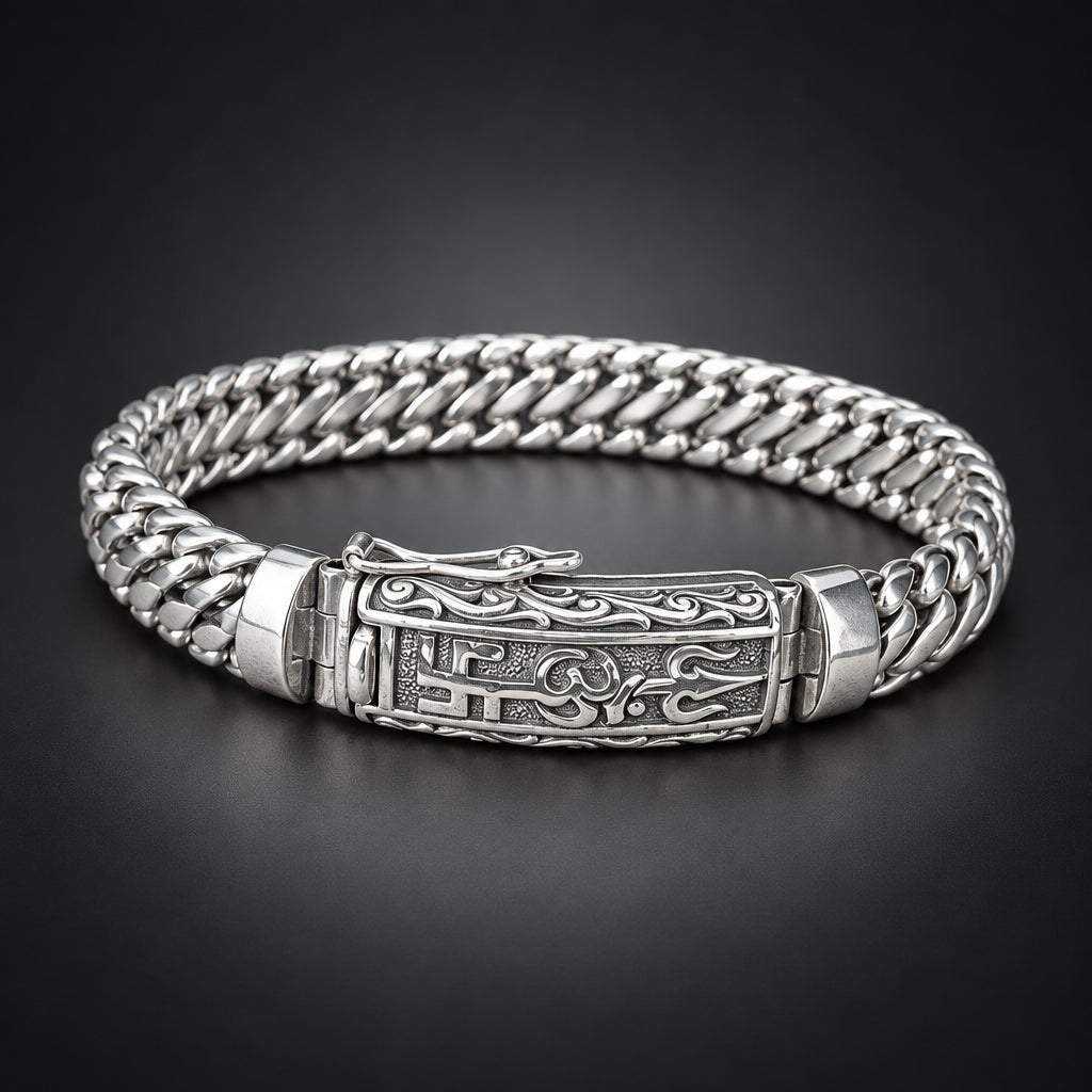 Silver bracelet with intricate design on a wooden surface
