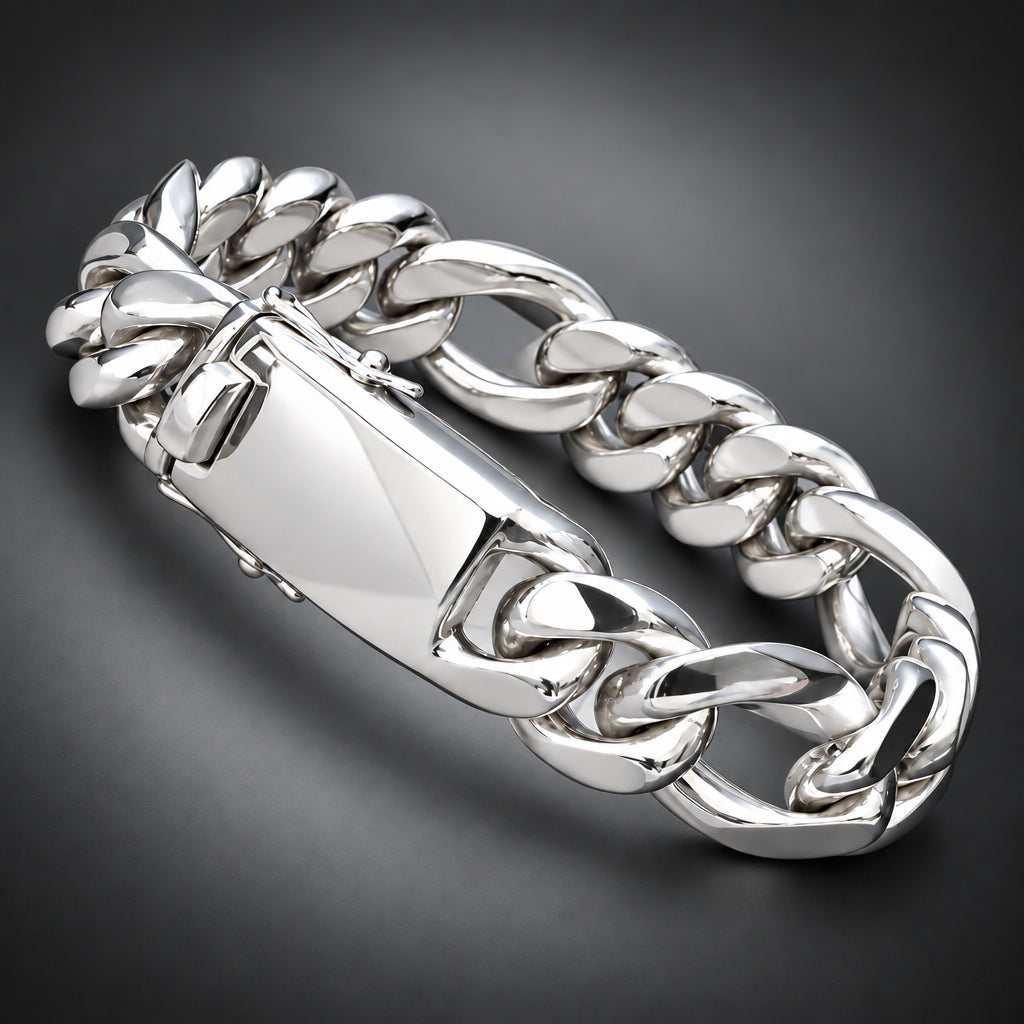 A polished silver-tone chunky chain bracelet with a large clasp, shown resting on a person's hand against a dark background.