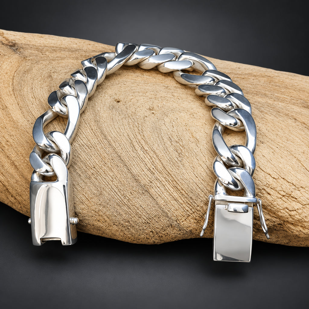 Silver chain bracelet with gold lock on a wooden surface