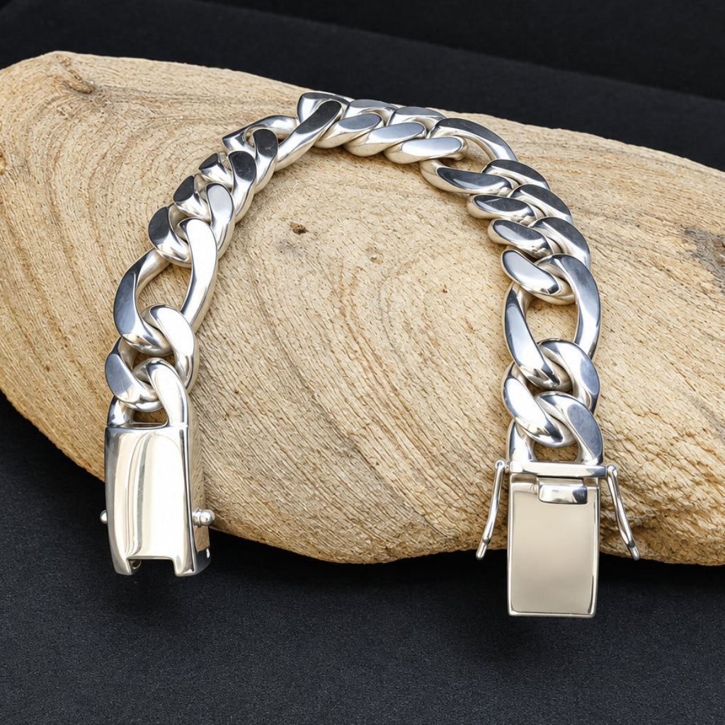 Silver chain bracelet on a wooden surface with a dark background
