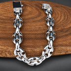 Silver chain bracelet on a wooden surface