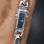 Silver bracelet on a palm surface
