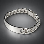 Silver chain bracelet on a light gray background