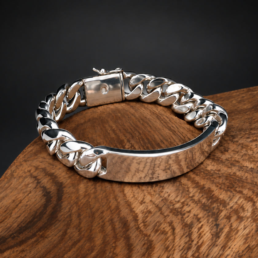 Silver chain bracelet on a wooden surface with a dark background