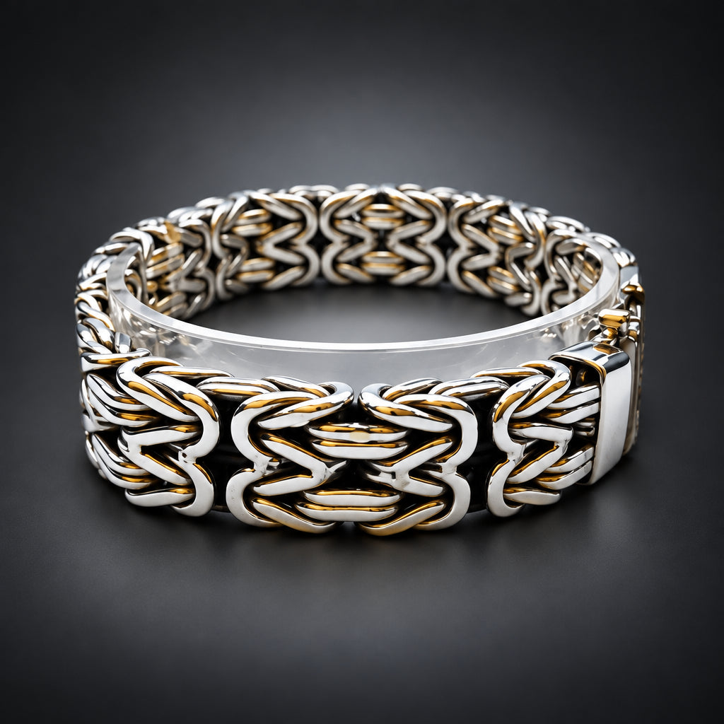 Silver and black braided bracelet on a dark background