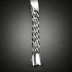 Silver chain bracelet on a dark gray background