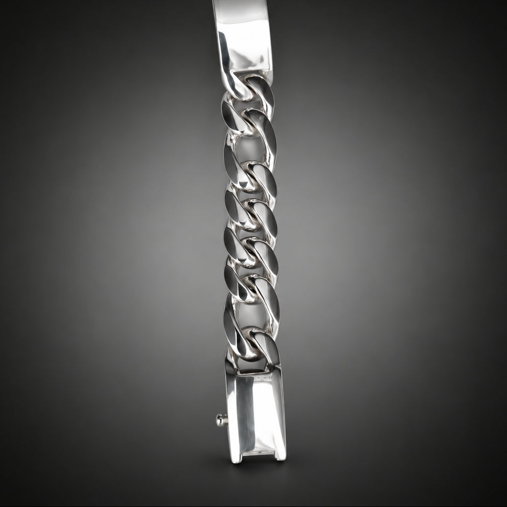 Silver chain bracelet on a dark gray background