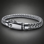 Silver braided bracelet on a dark background