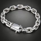 A silver-toned chunky chain link bracelet with a rectangular clasp, displayed on a dark gray gradient background.