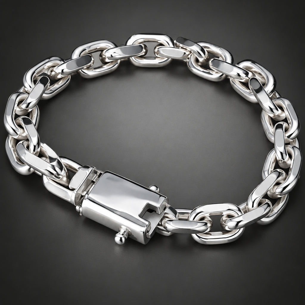 A silver-toned chunky chain link bracelet with a rectangular clasp, displayed on a dark gray gradient background.