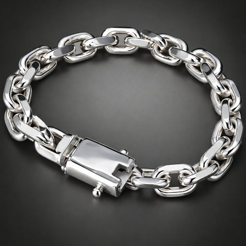 A silver-toned chunky chain link bracelet with a rectangular clasp, displayed on a dark gray gradient background.
