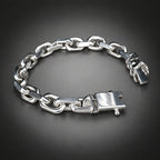 Silver chain bracelet on a wooden surface