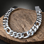 Silver chain bracelet on a wooden surface