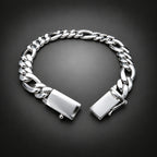A silver-toned Cuban link chain bracelet with a polished rectangular clasp, displayed open on a dark gray gradient background.