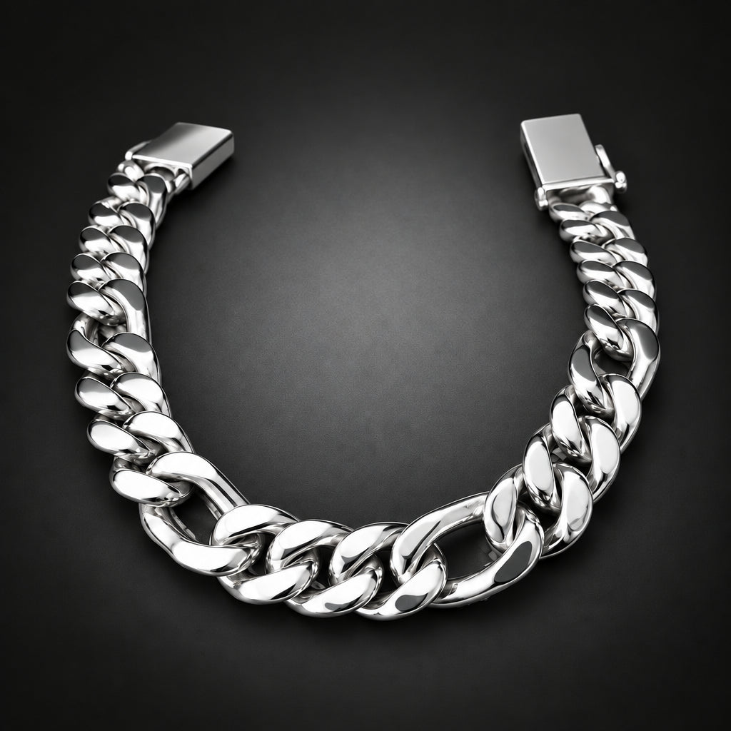 A chunky silver-tone Cuban link bracelet with a polished finish, displayed in a U-shape on a dark gray gradient background.