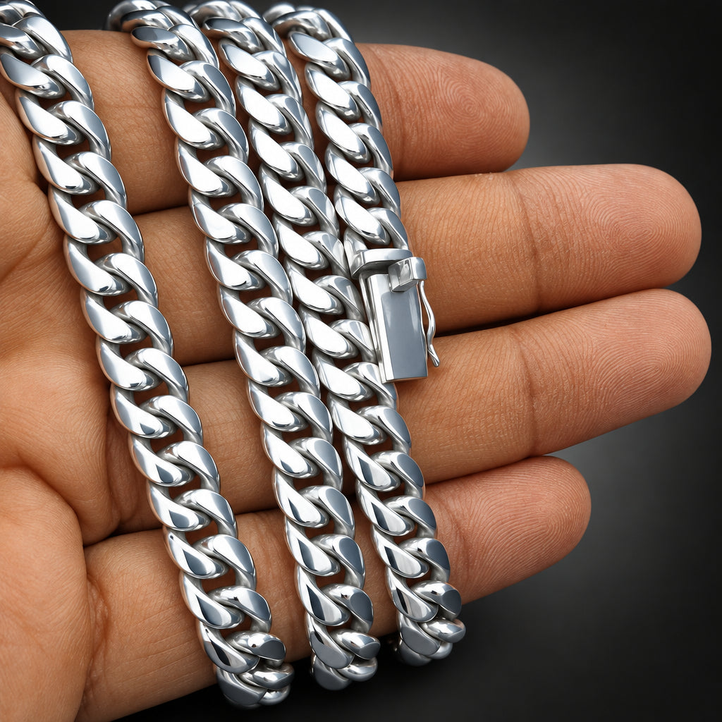 Silver chain bracelet on a hand against a dark background