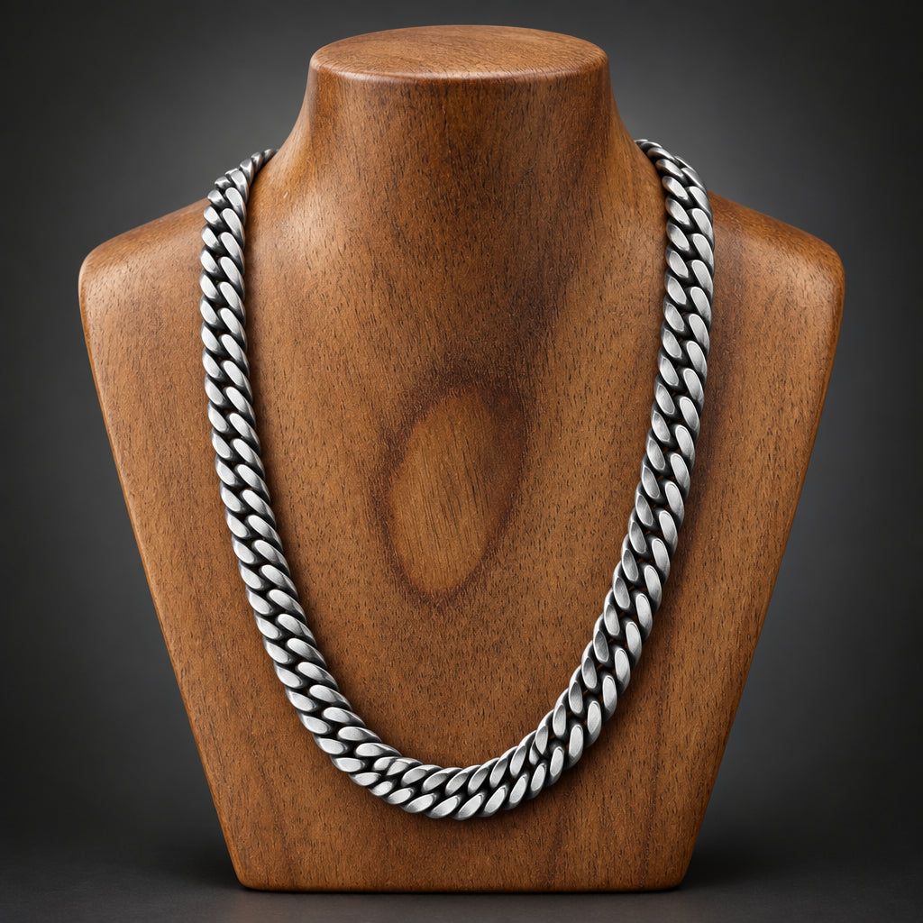 Silver chain necklace on a wooden surface