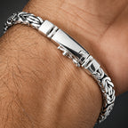 Silver bracelet on a wrist with a close-up view
