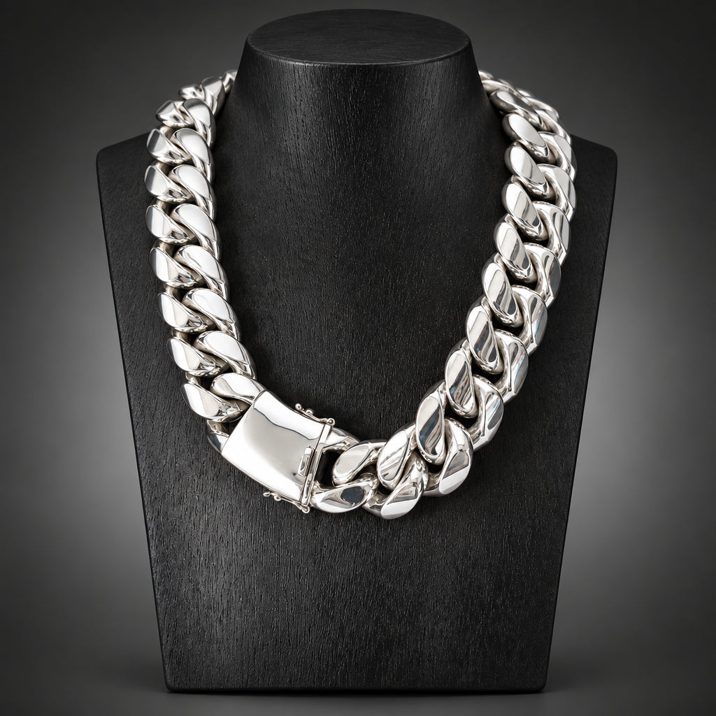 Silver chain necklace on a black stand