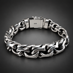 A chunky silver-tone steel chain bracelet with a clasp stamped '999', displayed on a rustic dark wood background.