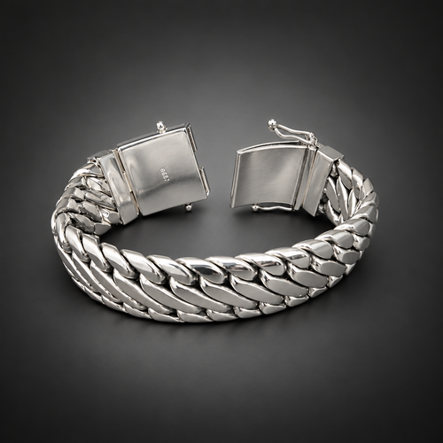 A silver-toned braided cuff bracelet with a clasp closure, displayed on a rustic dark wood surface.