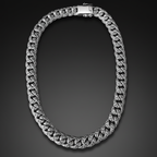 A silver-toned Cuban link chain necklace with a polished clasp, displayed against a solid black background.