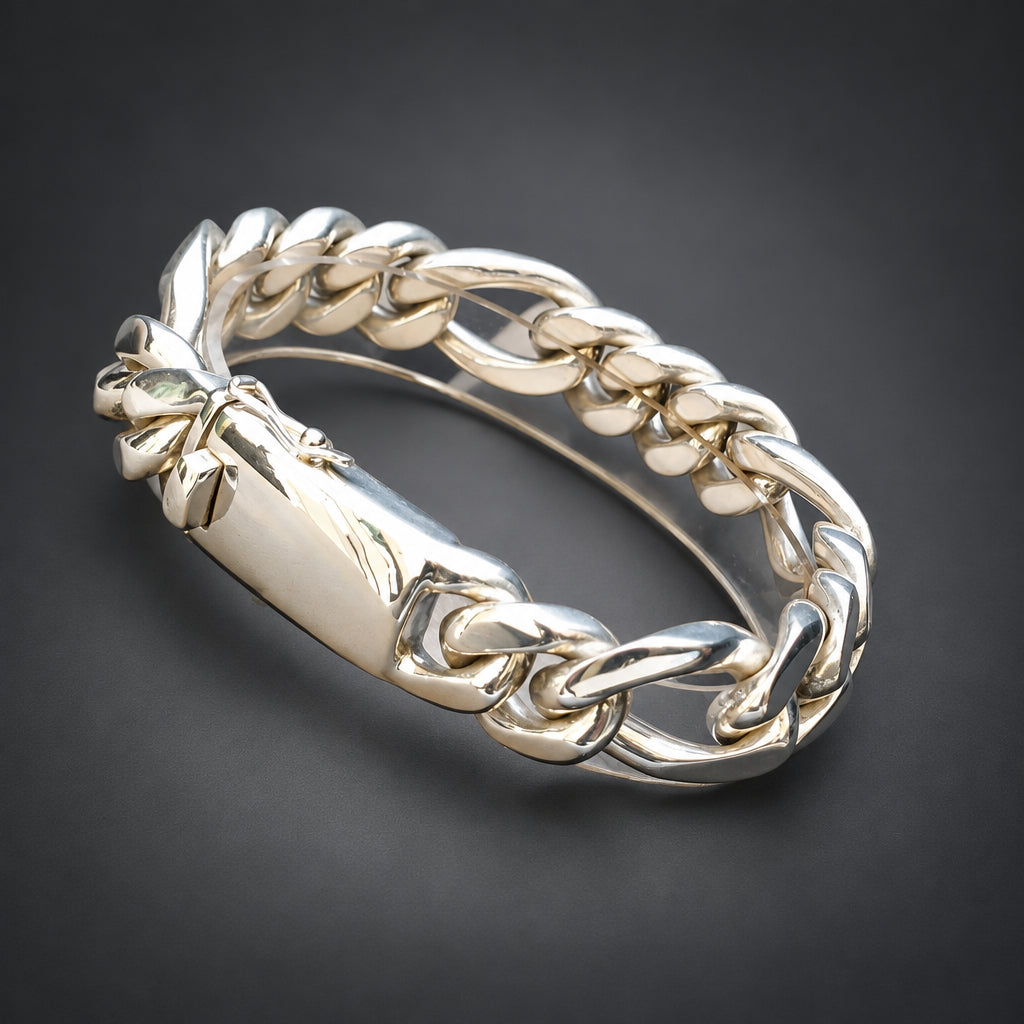 A wide, chunky silver-toned chain-link bangle bracelet in a dark background.
