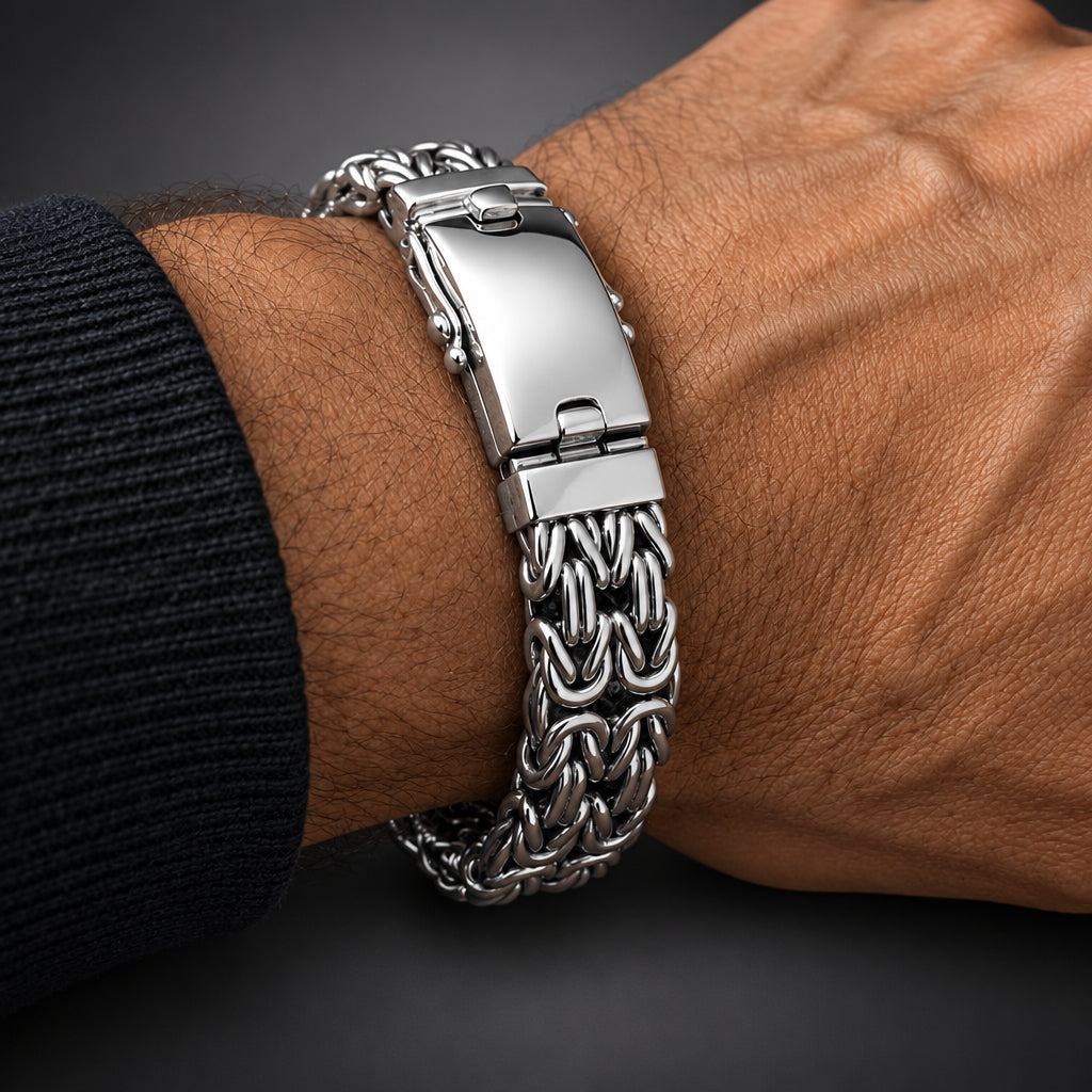 Silver bracelet on a wrist against a wooden background